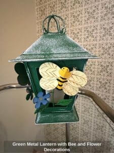 Green-Metal-Lantern-with-Bee-and-Flower-Decorations-1