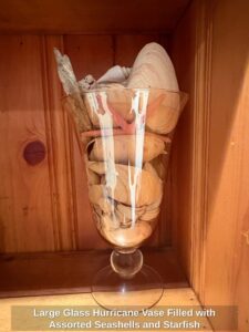 Large-Glass-Hurricane-Vase-Filled-with-Assorted-Seashells-and-Starfish