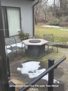 Octagonal-Gas-Fire-Pit-with-Two-Metal-Chairs