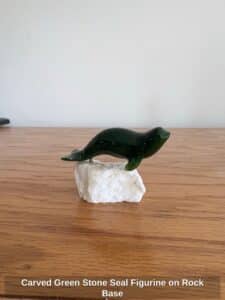 Carved-Green-Stone-Seal-Figurine-on-Rock-Base