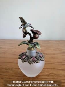 Frosted-Glass-Perfume-Bottle-with-Hummingbird-and-Floral-Embellishments