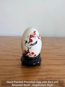 Hand-Painted-Porcelain-Egg-with-Bird-and-Blossom-Motif-Jingdezhen-Style