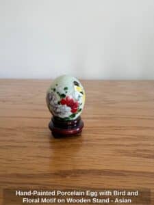Hand-Painted-Porcelain-Egg-with-Bird-and-Floral-Motif-on-Wooden-Stand-Asian-Style