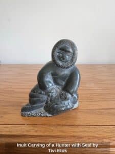 Inuit-Carving-of-a-Hunter-with-Seal-by-Tivi-Etok