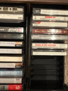 Assorted-Cassette-Tapes-Collection-with-Storage-Rack