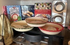 Vintage-Ceramic-Pie-Plates-and-Cookbooks-Lot-with-Metal-Muffin-Tin