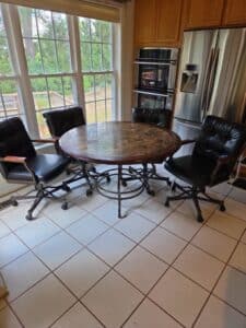 Round-Marble-Top-Dining-Table-with-Four-Leather-Chairs