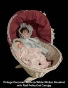 Vintage-Porcelain-Dolls-in-White-Wicker-Bassinet-with-Red-Polka-Dot-Canopy-233x300-2