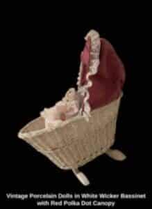 Vintage-Porcelain-Dolls-in-White-Wicker-Bassinet-with-Red-Polka-Dot-Canopy-second-image-219x300-2
