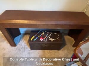 Console-Table-with-Decorative-Chest-and-Necklaces