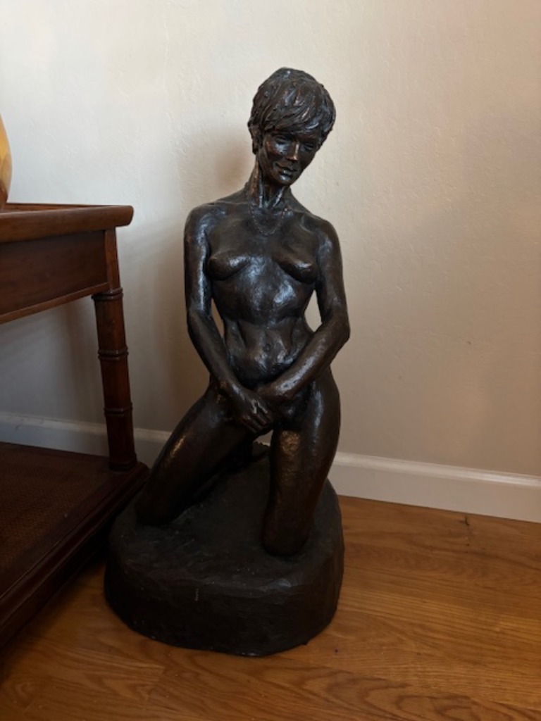 Art sculpture of woman wearing pearls