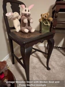 Vintage-Wooden-Stool-with-Wicker-Seat-and-Three-Stuffed-Animals