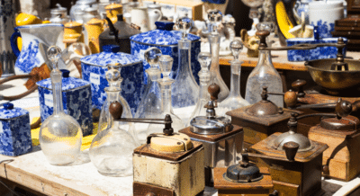 A photo of rows of neatly placed vintage items and glass bottles, signifying estate sale staging.