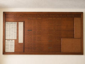 Museum-Quality Fort Worth Star-Telegram Chapel Slug Board An extraordinary original Fort Worth Star-Telegram Chapel Slug Board, measuring an impressive 4' x 8', used in the newspaper's composing room to organize printers, operators, machinists, proof room staff, and other production departments. This handcrafted hardwood board features carved lettering, original department nameplates, hundreds of brass hooks, and the original framed "Rules & Regulations – Star-Telegram Chapel Mutual Aid Society." A rare surviving piece of Fort Worth and newspaper history, this would make an incredible focal point in a home, restaurant, brewery, office, library, museum, or commercial space.