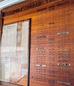 Museum-Quality Fort Worth Star-Telegram Chapel Slug Board An extraordinary original Fort Worth Star-Telegram Chapel Slug Board, measuring an impressive 4' x 8', used in the newspaper's composing room to organize printers, operators, machinists, proof room staff, and other production departments. This handcrafted hardwood board features carved lettering, original department nameplates, hundreds of brass hooks, and the original framed "Rules & Regulations – Star-Telegram Chapel Mutual Aid Society." A rare surviving piece of Fort Worth and newspaper history, this would make an incredible focal point in a home, restaurant, brewery, office, library, museum, or commercial space.