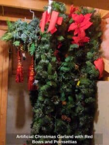 Artificial-Christmas-Garland-with-Red-Bows-and-Poinsettias