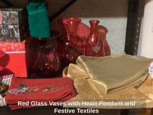 Red-Glass-Vases-with-Heart-Pendant-and-Festive-Textiles