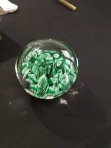 Glass-Paperweight-with-Green-Swirls