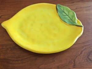Lemon-shaped-ceramic-plate-with-leaf-accent