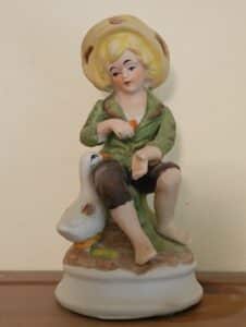 Boy-with-Goose-Figurine