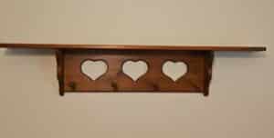 Wooden-Shelf-with-Heart-Cutouts-and-Pegs