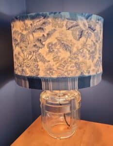 Upcycled-Vintage-Glass-Refrigerator-Pitcher-Lamp-with-Blue-Floral-Shade-second-image