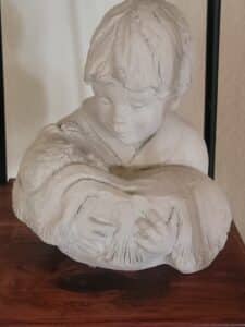 Austin-Productions-Bright-Eyes-Child-Holding-Bird-Sculpture