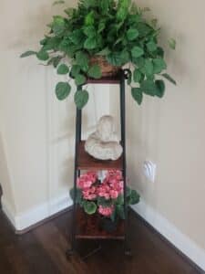 Tiered-Wrought-Iron-Plant-Stand-with-Bust-and-Faux-Flowers