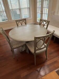 Oval-Pedestal-Dining-Table-with-Four-Lattice-Back-Upholstered-Chairs