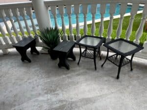Set-of-two-Wicker-Patio-Side-Tables-with-Glass-Tops-and-two-Distressed-Wooden-Stools