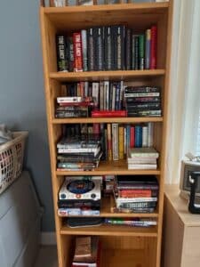 Assorted-Collection-of-Books-on-a-Wooden-Bookshelf