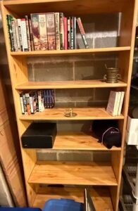 Pine-Wood-Bookshelf-with-Assorted-Books-and-Decorative-Items