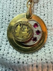 Vintage-K-Gold-Filled-Charm-Bracelet-with-North-Carolina-Seal-Medallion-and-Ruby-Accents-second-image