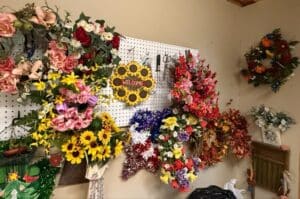 Assorted-Decorative-Wreaths-and-Floral-Arrangements-Primarily-Sunflower-Themed