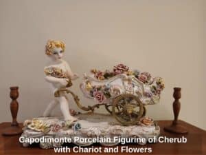 Capodimonte-Porcelain-Figurine-of-Cherub-with-Chariot-and-Flowers