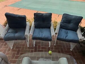 Set-of-White-Wicker-Patio-Chairs-with-Dark-Blue-Cushions