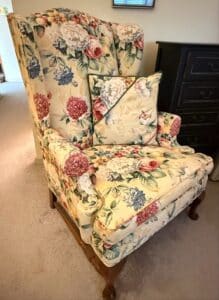 Vintage-Floral-Chintz-Upholstered-Wingback-Armchair-with-Decorative-Pillow