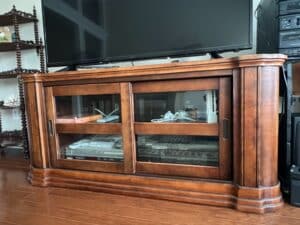 Wooden-Media-Console-with-Sliding-Glass-Doors-and-Stepped-Base