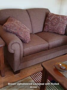 Brown-Upholstered-Loveseat-with-Rolled-Arms
