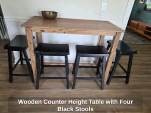 Wooden-Counter-Height-Table-with-Four-Black-Stools