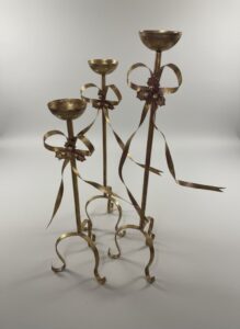 Gold-Toned-Metal-Candelabra-with-Bow-and-Holly-Motif