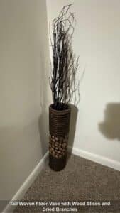Tall-Woven-Floor-Vase-with-Wood-Slices-and-Dried-Branches