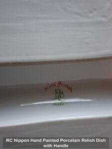 RC-Nippon-Hand-Painted-Porcelain-Relish-Dish-with-Handle-second-image