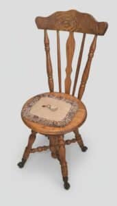 Oak-Spindle-Back-Piano-Stool-with-Embroidered-Seat