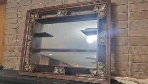 Ornate-Mirrored-Wall-Shelf-with-Decorative-Accents
