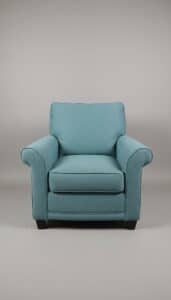 Teal-Upholstered-Club-Chair-with-Embroidered-Pillows