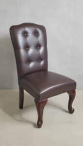 Traditional-Round-Pedestal-Dining-Table-with-Tufted-Leather-Chairs-second-image