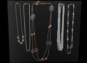 Vintage-Costume-Jewelry-Necklace-Collection-with-Peace-Sign-and-Star-Motifs