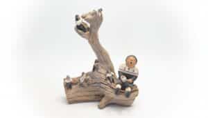 Vintage-Storyteller-Pottery-Figurine-on-Driftwood-Not-Signed