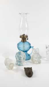 Vintage-Blue-Glass-Coin-Spot-Oil-Lamp-with-Figural-Glass-Paperweights